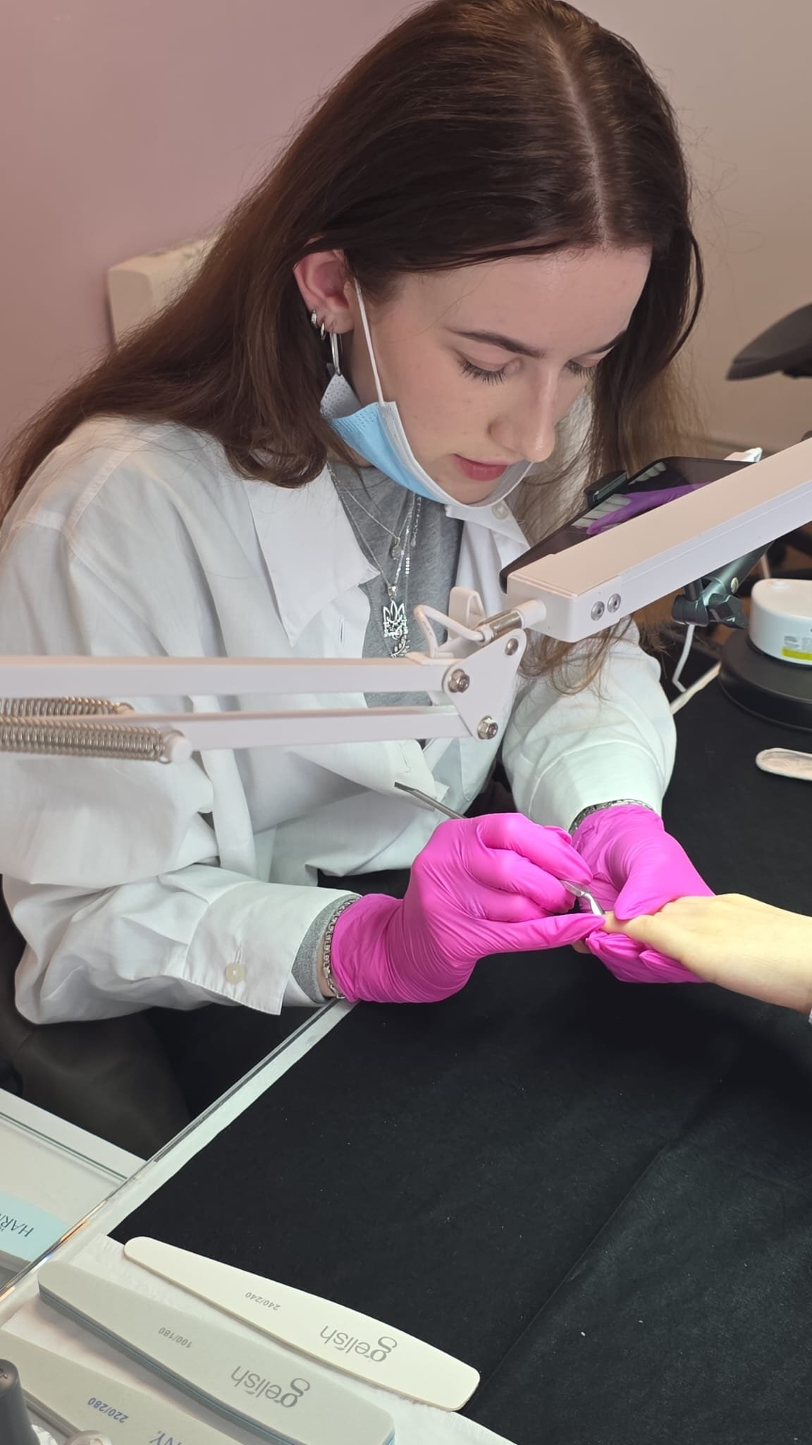 Nail application being practised at a training table
