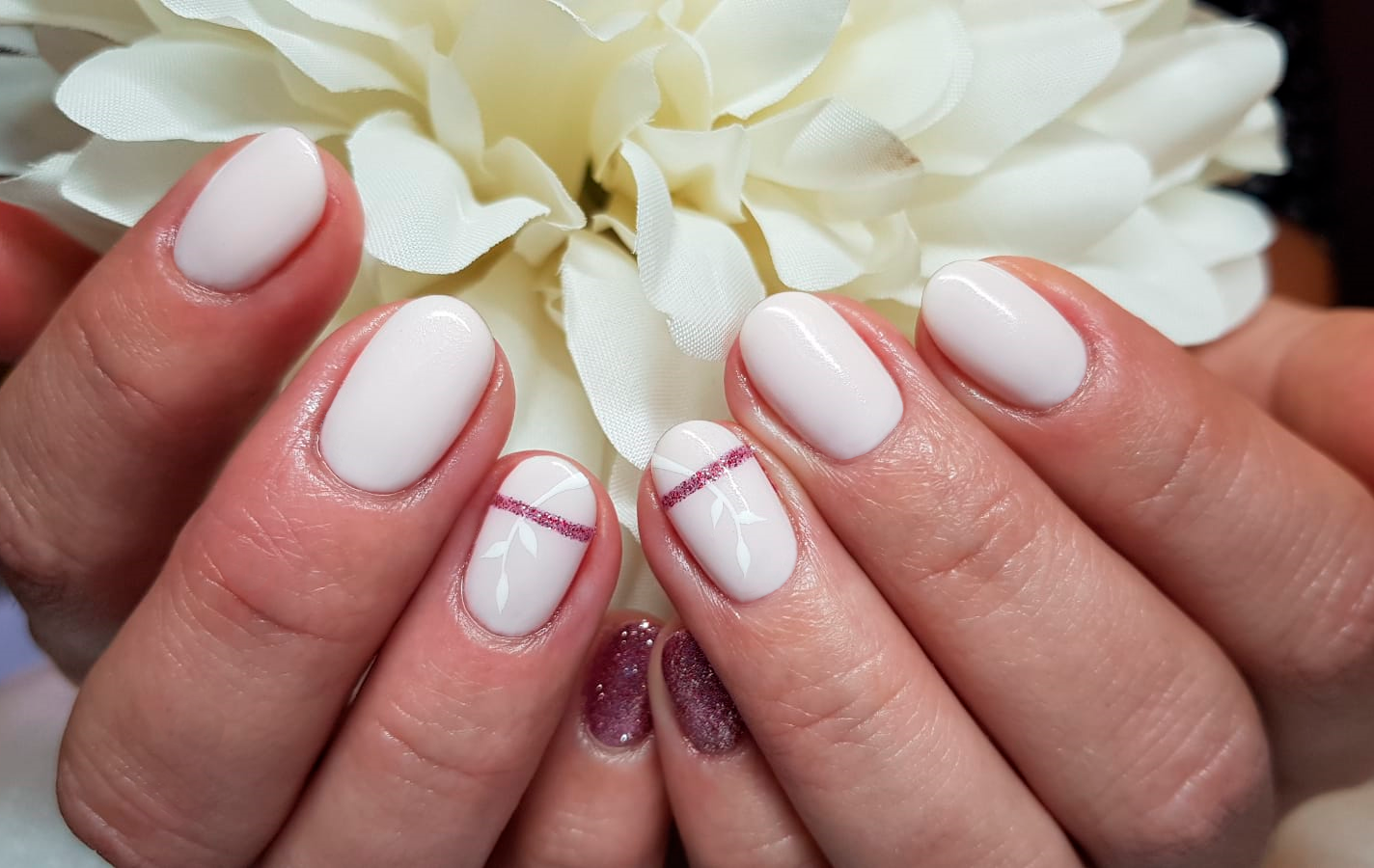 Pale pink nails with white and silver line detail