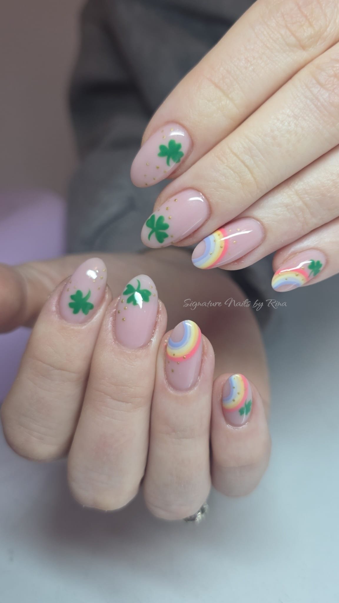 Pastel nail art with shamrocks and rainbows