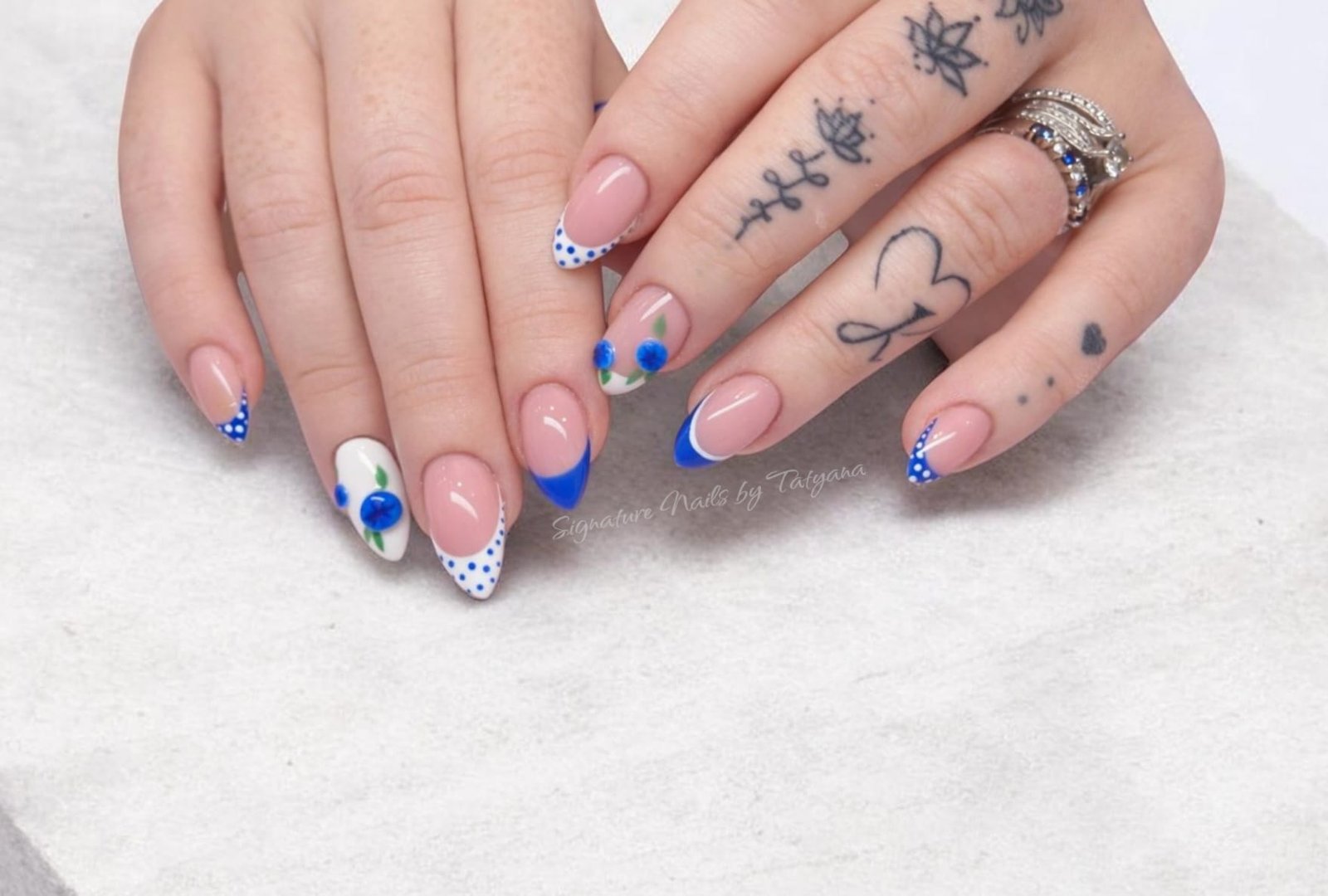 Pink, blue and white nail art with fine line detail