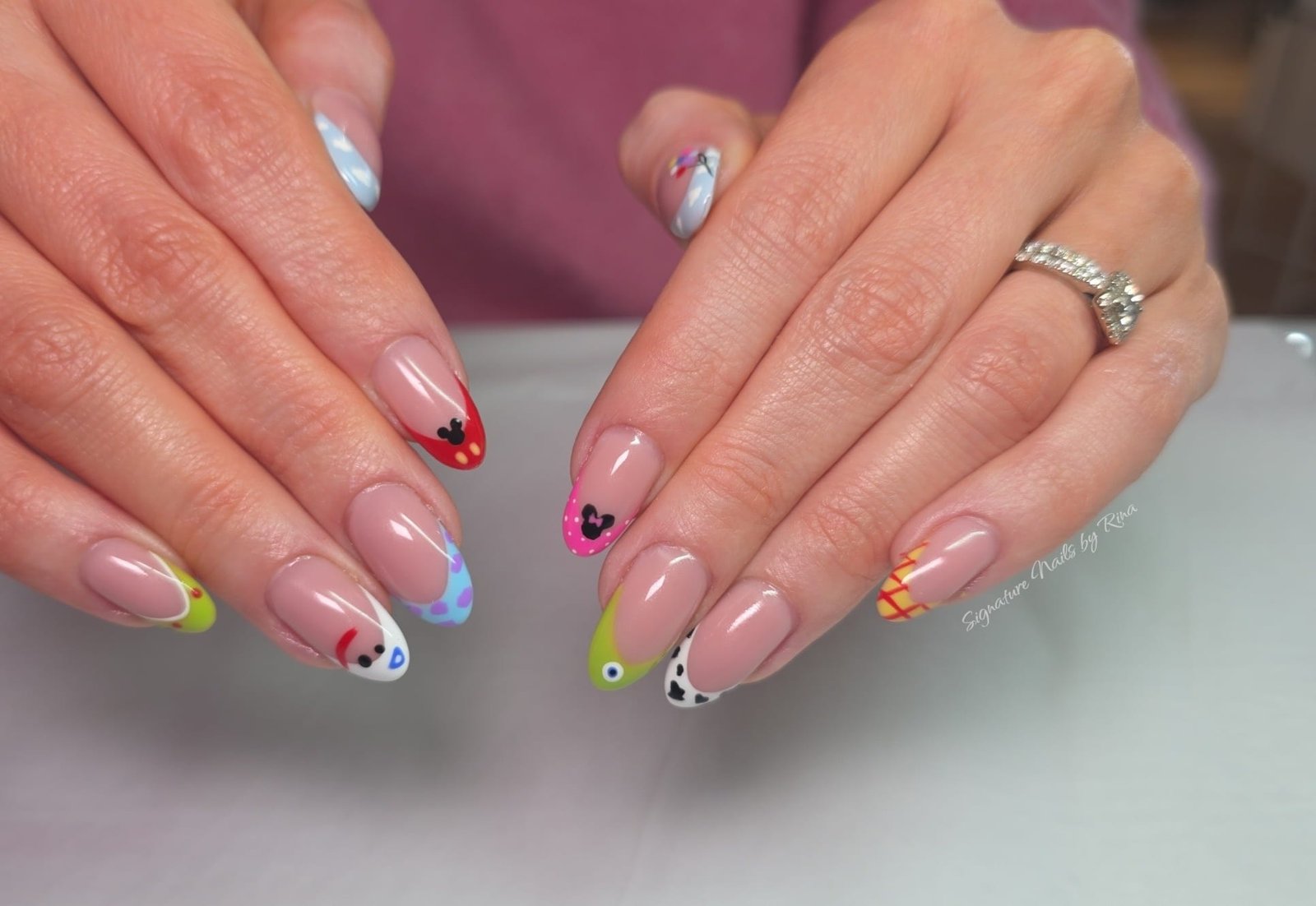 Pink nails with colourful abstract line art