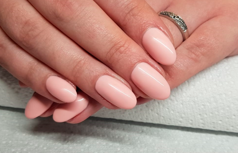 Glossy nude almond-shaped nails