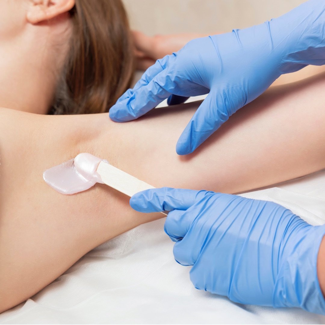 Wax being applied during a leg treatment