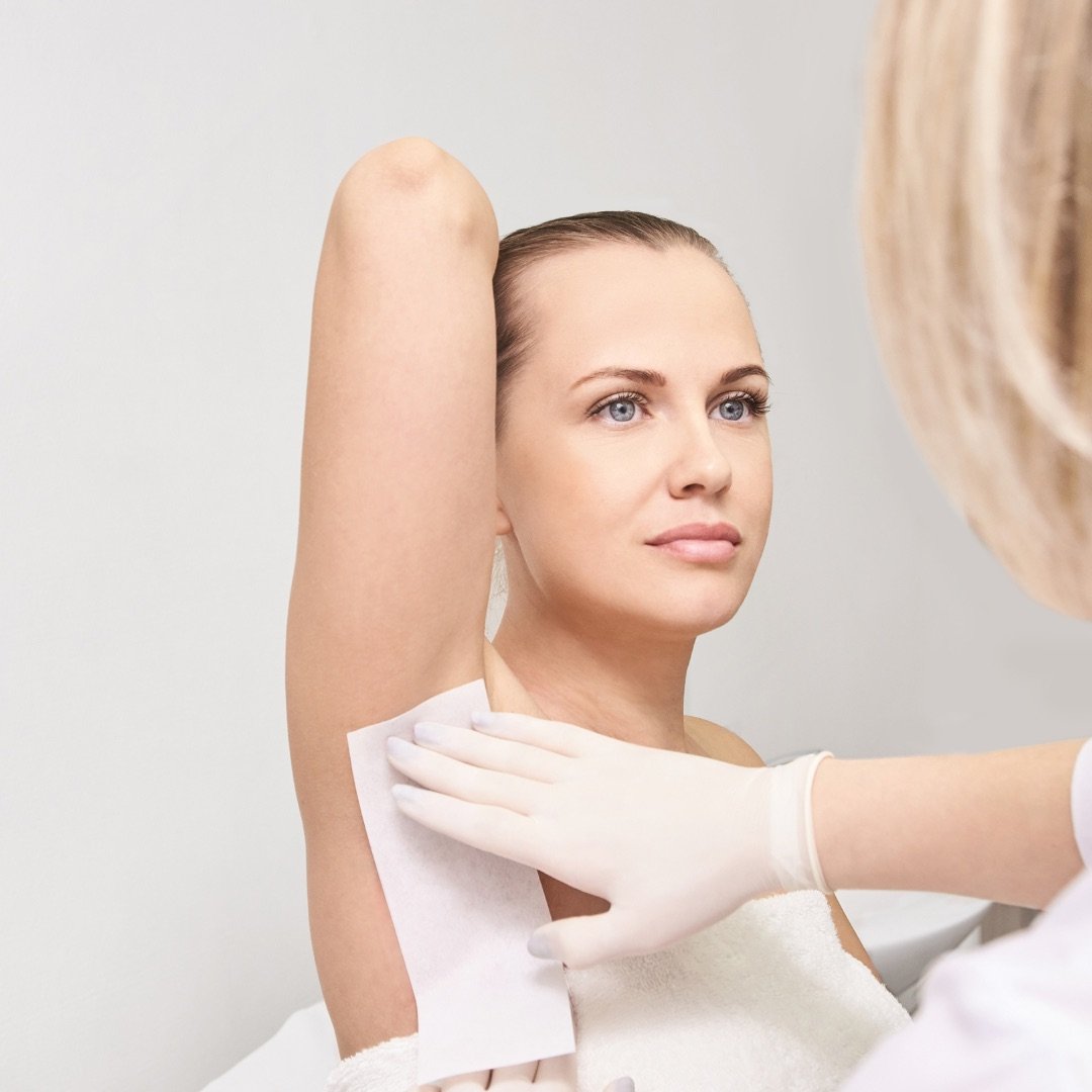 Wax being applied during an underarm treatment